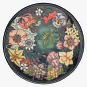 A modern Moorcroft 'Carousel' charger designed by Rachel Bishop