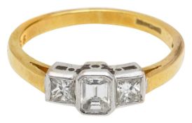 A three stone diamond and 18ct gold ring