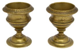A pair of late 18th century polished bronze egg cups