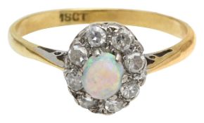 An opal and diamond cluster ring