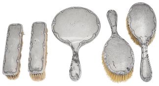 A George V silver five piece dressing table set