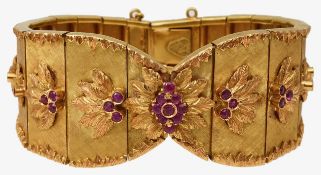 A wide articulated bracelet with ruby detail