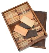 A cabinet makers teak cased set of specimen timbers