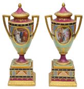 A pair of Royal Vienna porcelain twin handled pedestal vases and covers c.1900