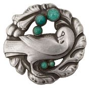 A silver and adventurine dove brooch