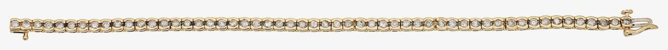An 18ct gold and diamond line bracelet