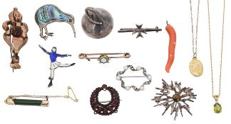 A silver Hershey Kiss pendant, diamond and peridot necklace, sweetheart locket and an array of brooc