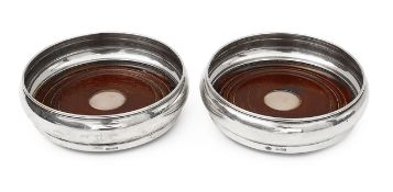 A pair of Elizabeth II silver wine coasters