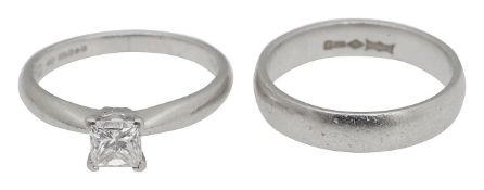 A platinum diamond square ring with wedding band