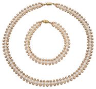 A fancy 'caterpillar' cultured pearl necklace and bracelet