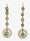 A pair of elegant five stone articulated peridot drop earrings
