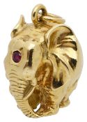 A solid 18ct gold and ruby elephant pendant