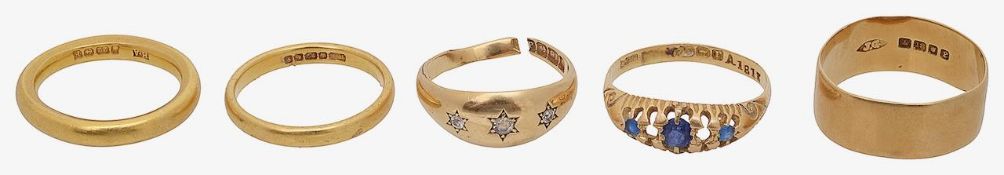 A collection of rings including a diamond gypsy set ring, a 1854 hallmarked 22ct plain band and thre