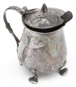 Oliver Baker for Liberty & Co. An Arts & Crafts silver Cymric mustard pot