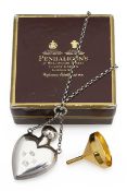 A Penhaligons silver heart shaped perfume bottle