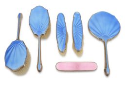 A George V blue guilloche enamel and silver dressing table set