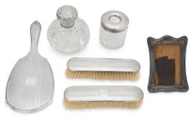 Two George V silver mounted dressing table brushes, mirror and other items