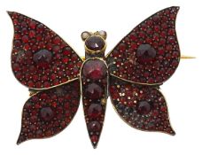 A garnet butterfly brooch