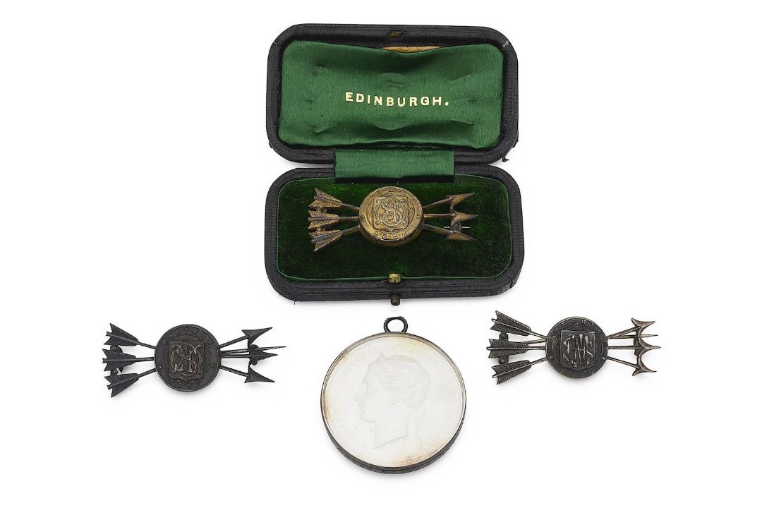 A 19th century silver Grand National Archery Meeting medal by Wyon and prize brooches