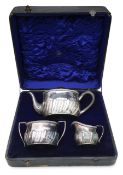 An electroplated three piece tea service retailed by Jays, Oxford Street