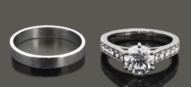 A diamond single stone ring and wedding band