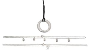 Three Tiffany & Co silver pendants