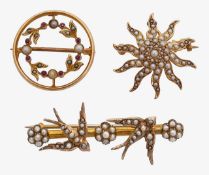 Two Edwardian brooches and Edwardian sunburst pendant/brooch