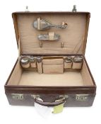 A George V tan leather travelling case with silver mounted fittings