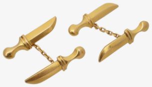 A pair of Islamic cufflinks in the form of daggers