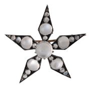 A moonstone star brooch pendant