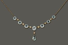 A delicate Edwardian aquamarine and seed pearl necklace
