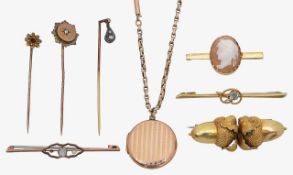A 9ct cameo brooch, 15ct stick pin knot with aquamarine, two diamond stick pins and a double acorn b