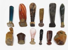 A collection of desk seals mostly with hardstone handles