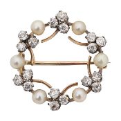 An elegant diamond and seed pearl wreath brooch