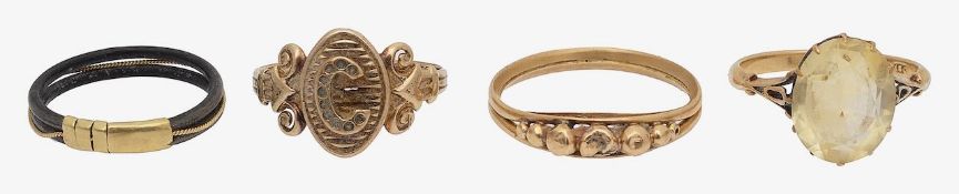 A citrine ring, a signet ring an elephant hair ring and two other