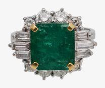 An emerald and diamond-set cluster ring