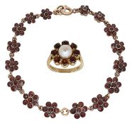 An elegant garnet daisy bracelet and a 9ct gold garnet and pearl daisy ring