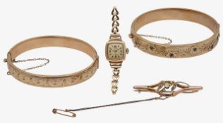 Two stiff bangles, peridot brooch and a 9ct gold watch