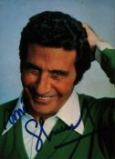 Gilbert Becaud signed 7x5inch colour photo. Good condition Est.