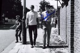 Marin Peters signed 12x8 inch black and white photo pictured with Bobby Moore.. Good condition Est.