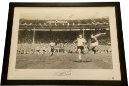 Geoff Hurst signed 25x18 framed photo of Geoff Hurst scoring the winning goal in the 1966 World