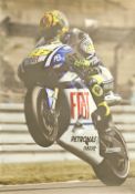 Valentino Rossi signed 24x17 colour print unsigned. Rolled. Good condition Est.