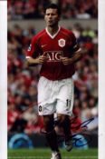 Ryan Giggs signed 12x8 inch colour photo pictured in action for Manchester United. Good condition.