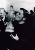 Gary Player signed 12x8 inch black and white photo pictured with the Open Championship claret jug.