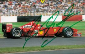 Michael Schumacher signed 6x4 inch colour photo pictured driving for Ferrari in Formula One. Good