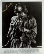 Miles Davis signed 10x8 inch black and white promo photo. Good condition. All autographs come with a