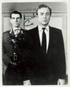 Pierce Brosnan and Michael Caine signed 10x8 inch black and white photo. Good condition. All