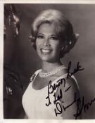 Dinah Shore signed 10x8 inch black and white photo. Good condition. All autographs come with a