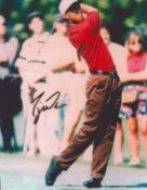 Tiger Woods signed 10x8 inch colour photo. Good condition. All autographs come with a Certificate of