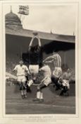 Peter McParland signed 12x18 inch black and white photograph pictured as he challenges Manchester